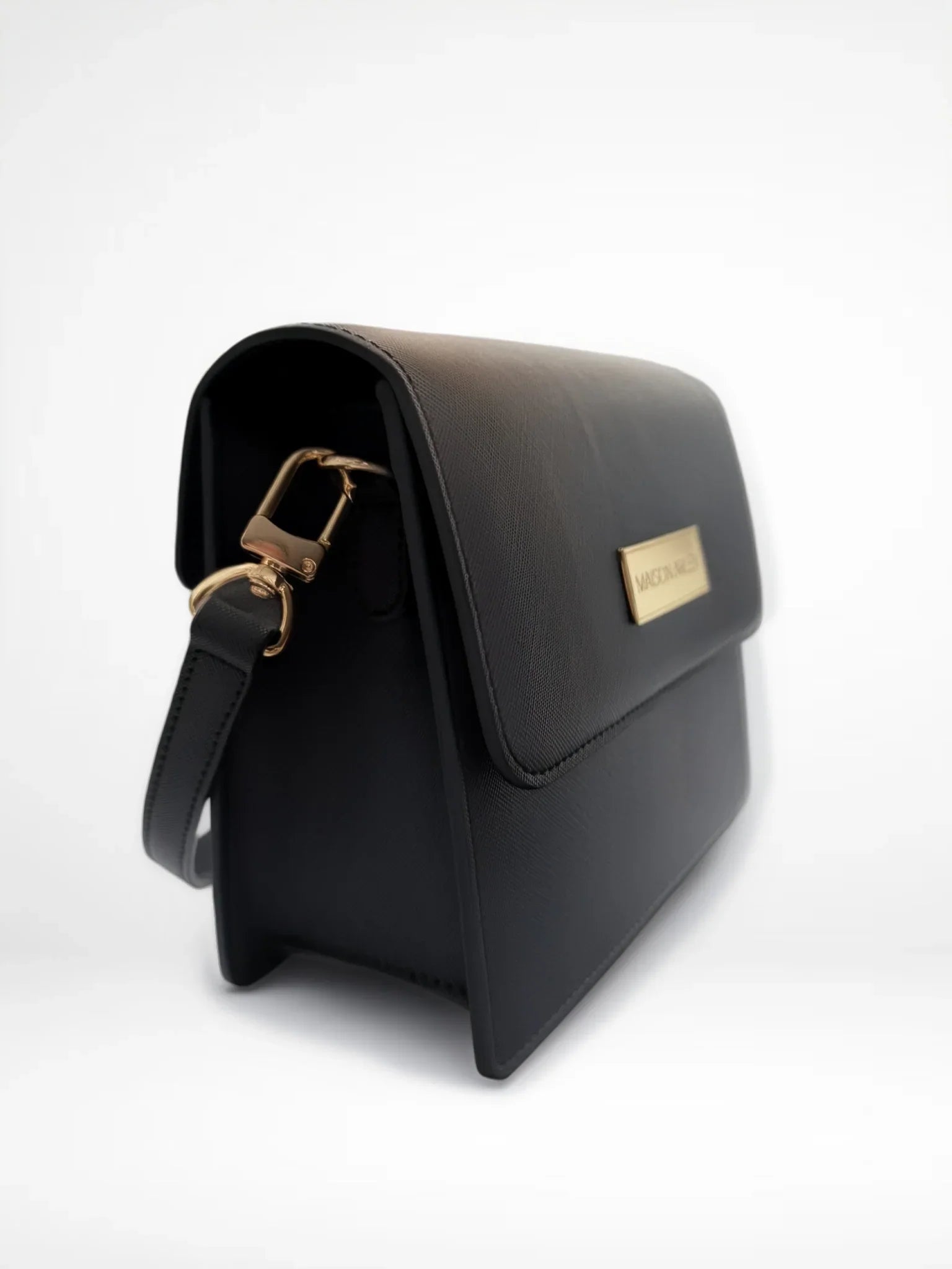 Maison Arlen Legacy Bag Black Edition side view with gold buckle and gold logo plaque on white background